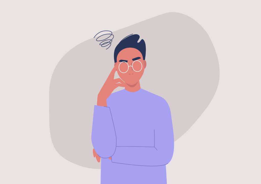 male holding hand to head, thinking